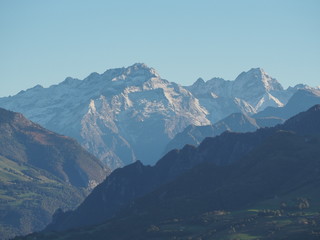 Wonderful aerial landscape at the Orobie Alps, fall season first fresh snow at mountians. Albino, Italy