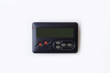 Old beeper or pager isolated on white background