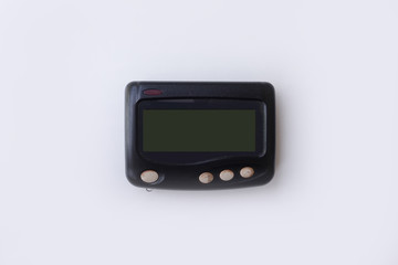 Old beeper or pager isolated on white background