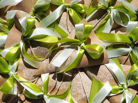 Handmade paper favors with green and white bow
