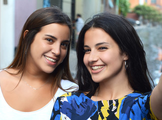 Two young women making selfie.