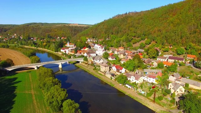 Camera flight over The Berounka river near Zbecno. Beautiful natural park in Czech Republic. European landmarks from above.