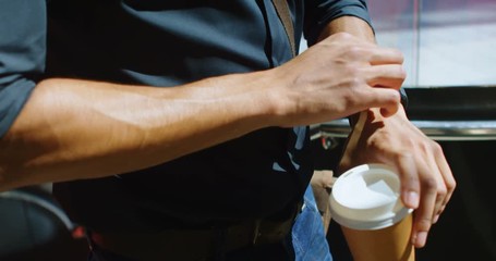 Male commuter using smartwatch in office building 4k - Powered by Adobe