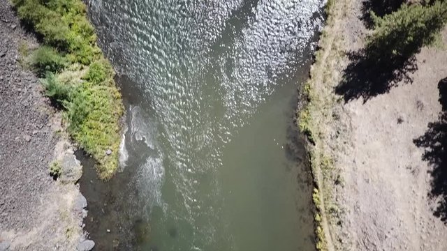 Flight in the high desert of central Oregon over premier flyfishing trout stream in the crooked river canyon