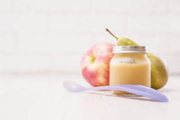 Organic baby food.Puree with fruit. Baby food on white