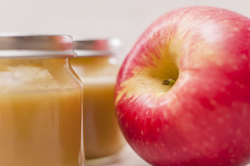 Organic baby food. Puree with fruit. Baby food on white