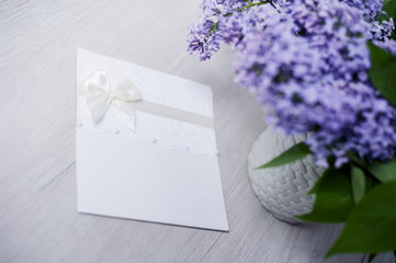 Fresh lilac flowers on a wooden table