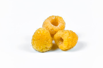 Set of yellow raspberry berry fruits on white background.