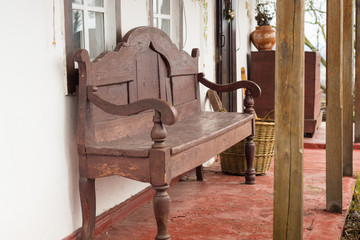 Vintage wooden bench on the terrace of a traditional Ukrainian house