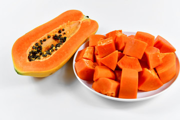 Tropical papaya fruit slices in dish