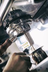 Making espresso with machine 