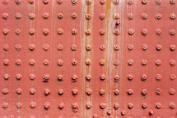 Riveted metal wall surface