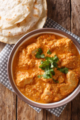 Chicken Changezi - The highly popular dish from the streets of old Delhi close-up on a plate. Vertical top view