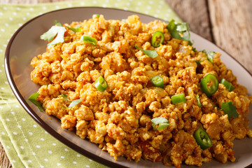 Spicy Indian Chicken Keema, with Onions, Tomatoes and Mince Closeup on a Plate. horizontal