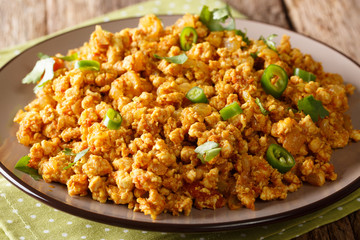 Indian dish Chicken Keema, with onions, tomatoes, spices and minced meat closeup. horizontal