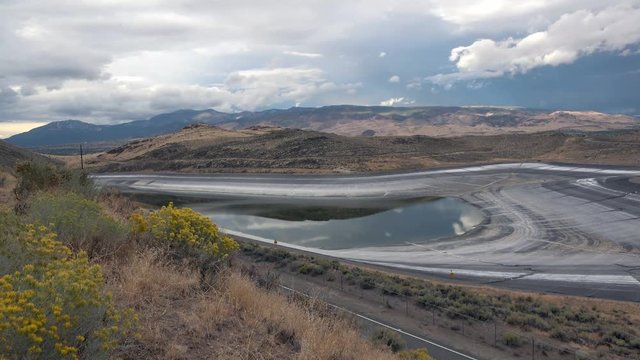 Timelapse of drained reservoir due to drought, summertime in the desert