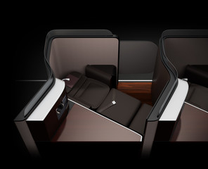 Luxury business class suite interior on black background. Reclining seat in fully flat mode. 3D rendering image.