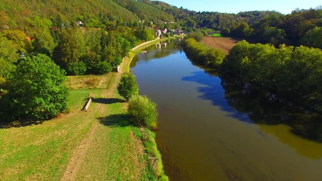 Camera flight over The Berounka river near Zbecno. Beautiful natural park in Czech Republic. European landmarks from above.