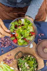 Fresh juicy summer salad, vegan vegetarian food, healthy paleo diet. Tomatoes, salad leaves