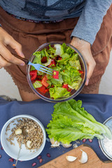 Fresh juicy summer salad, vegan vegetarian food, healthy paleo diet. Tomatoes, salad leaves