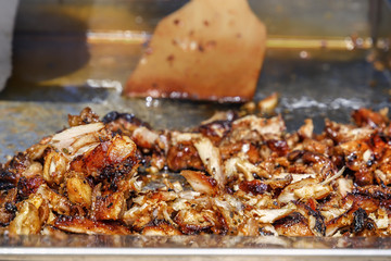 Fried meat for the preparation of donors or shawarma. Close-up. Copy space
