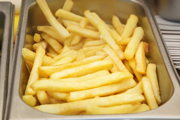 Freshly cooked French fries. Fast food