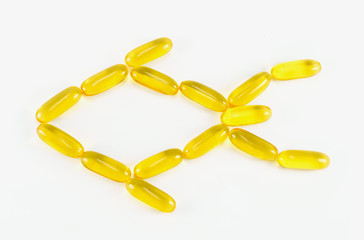 fish oil pill in fish sign on white background