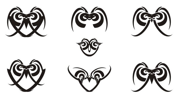 Tribal black and white laconic owl icons. The decorative linear icons of owls formed by simple elements for your design