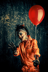 scary clown with balloon