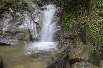 Fototapeta na wymiar small waterfalls in tropical forest.