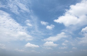 Dramatic blue sky with fluffy clouds texture background.