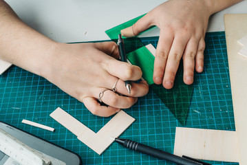 A Woman architecture student working on models
