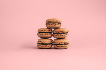 Macaroons isolated on pink background with copyspace