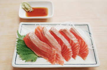 Fresh Raw Salmon Slide Serve with Wasabi and Sauce at Fish Market  