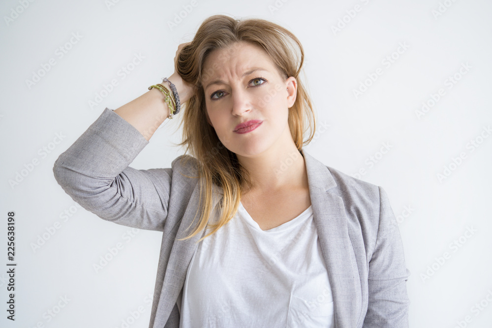 Sticker Worried pretty woman touching hair. Lady looking at camera. Problem concept. Isolated front view on white background.