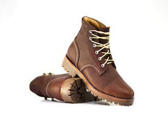 Men’s ankle boot with oil full grain leather isolated on white background, closed up