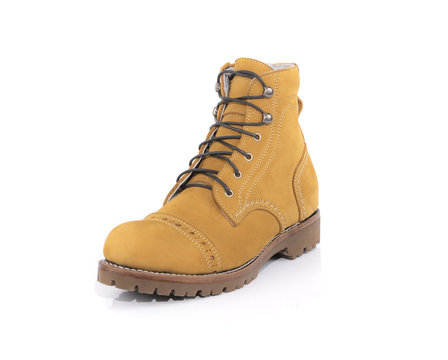 Men&rsquo;s yellow boots isolated on white background.