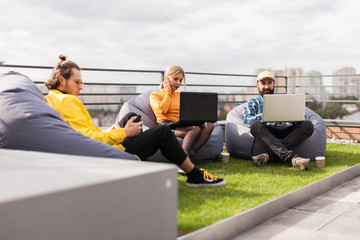 Business lifestyle in the roof garden, creative space. Bean bag chair in office.