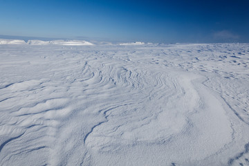 Snow plain on top of the mountain, Murmansk region, Russia