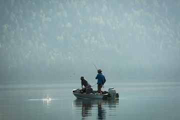 Two fishermen fishing in the river