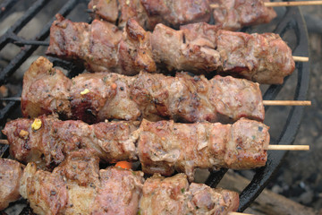 Closeup of pork skewers on the BBQ