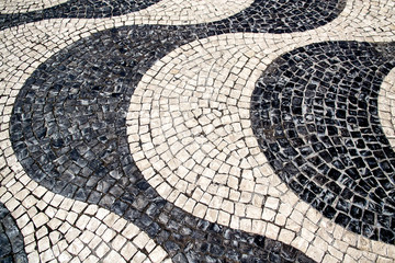 Pavement of black and white. The texture of the pavement. Selective focus