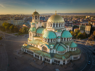 Obraz premium Alexander Nevsky cathedral in the golden light of the sunset - beautiful aerial shot of the famous landmark in Sofia, Bulgaria - a magnificent Orthodox church in the city center