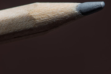Pencil is macro on brown background