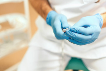 Closeup shot of dentists hands holding dental tool