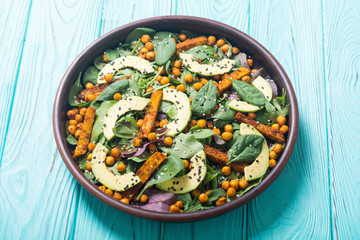 Baby spinach salad with sweet potato , chickpeas and avocado