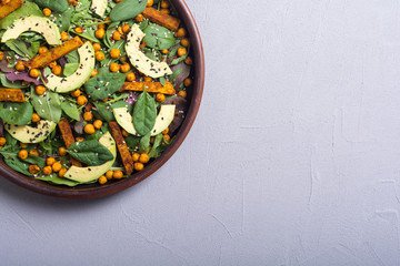 Baby spinach salad with sweet potato , chickpeas and avocado