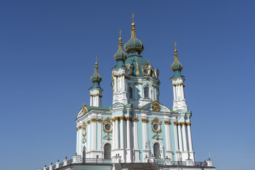Fototapeta na wymiar Bright St. Andrew church towers over Kiev, Ukraine
