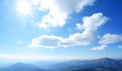 Obraz premium Mountain landscape, hills, stones, rocks and blue sky with clouds. Nature background.