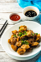 Fried dumplings with soy sauce with pepper and green onions. Asian cuisine